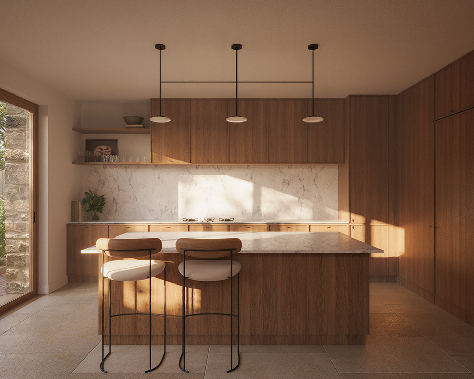Contemporary kitchen with walnut cabinetry, a stone island, marble splashback and warm afternoon light filtering across natural materials.