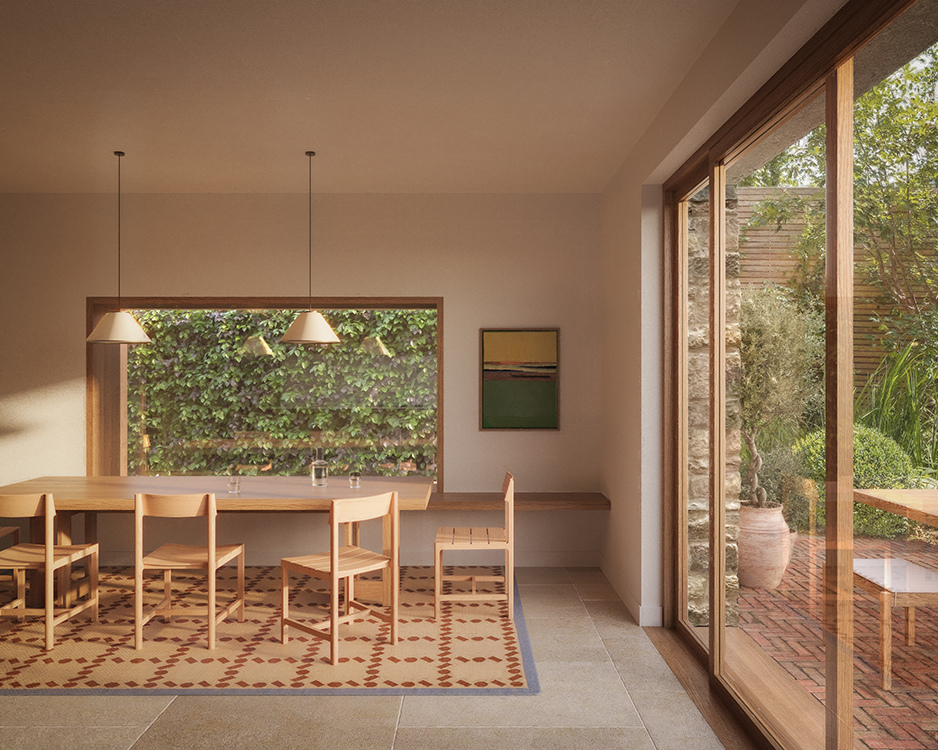 Dining space overlooking a landscaped courtyard garden, featuring large sliding doors, built-in seating, natural timber furniture and soft daylight.