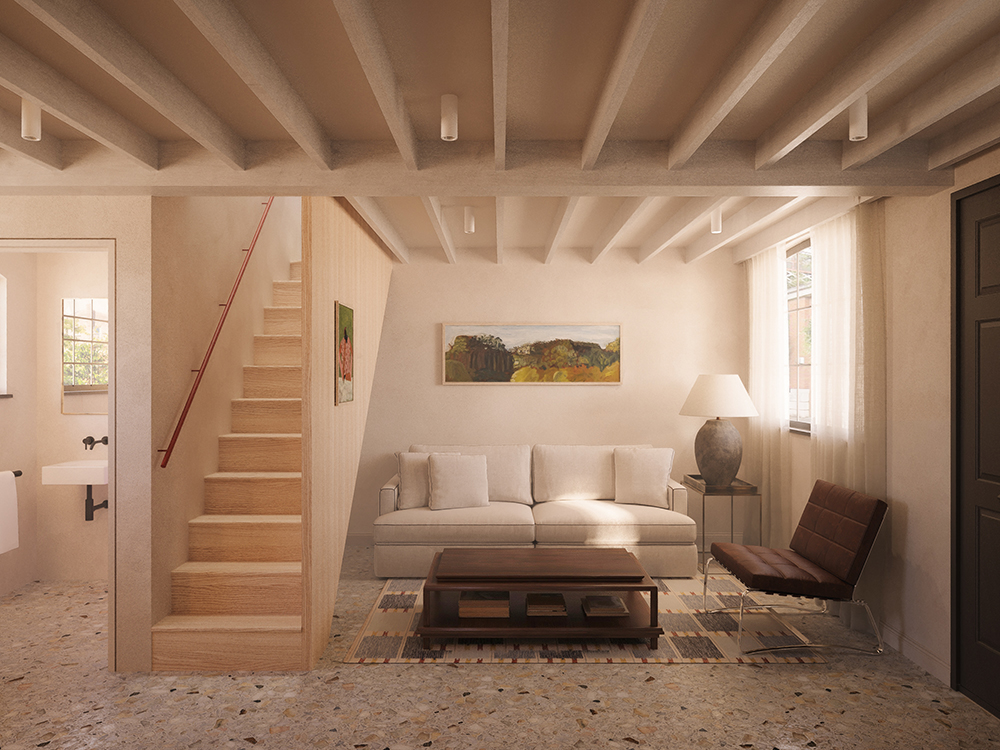 Open-plan living room with timber staircase, terrazzo floor, exposed ceiling beams and integrated kitchen beyond.